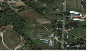 Laughing Stock Farm fields.  Permanent beds have been re-oriented to shed water. (Google)