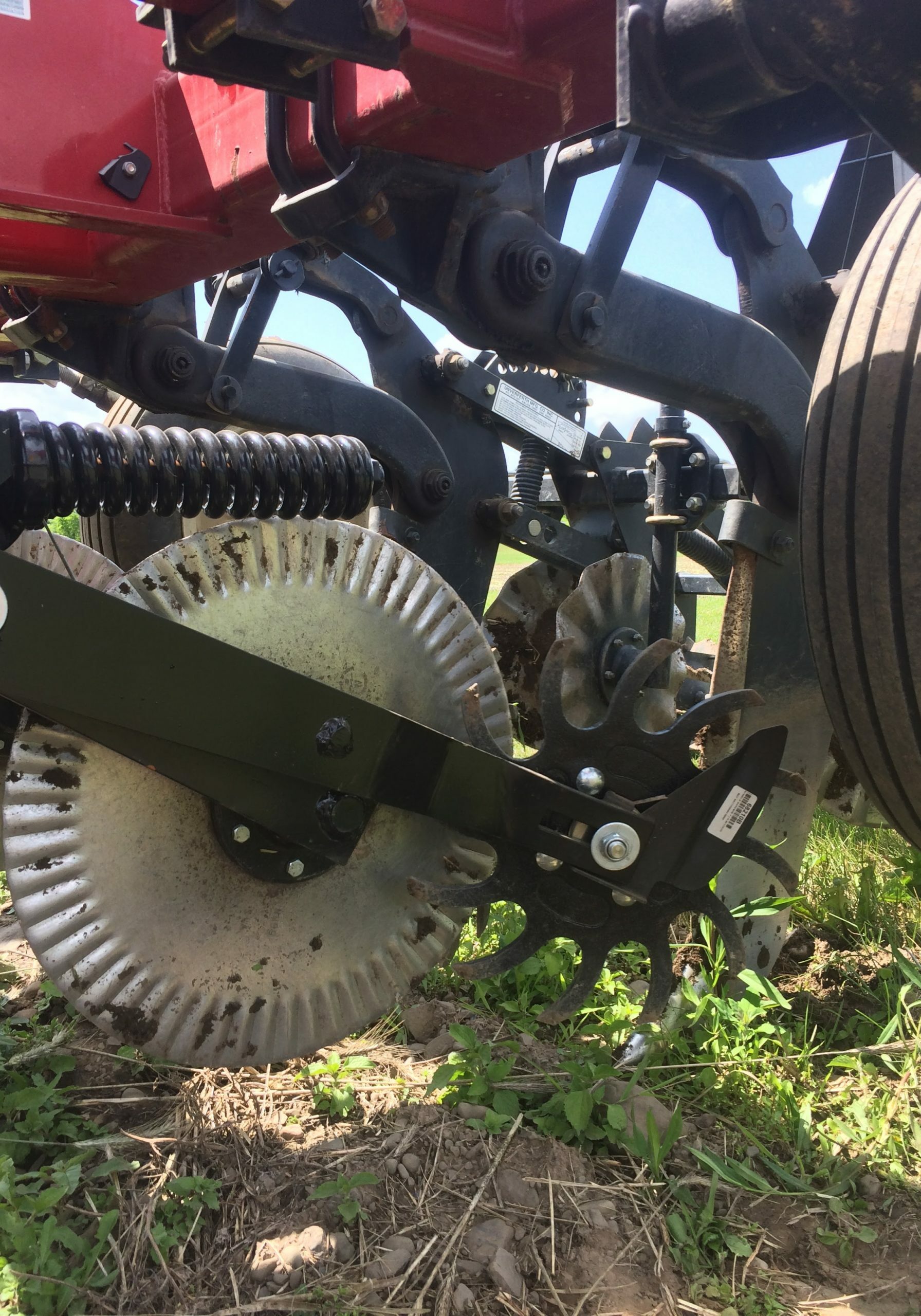 Row cleaners that run in advance of strip tillage tools help rake residue out of the planting zone, concentrating it into between-row areas, which helps create a better planting bed.